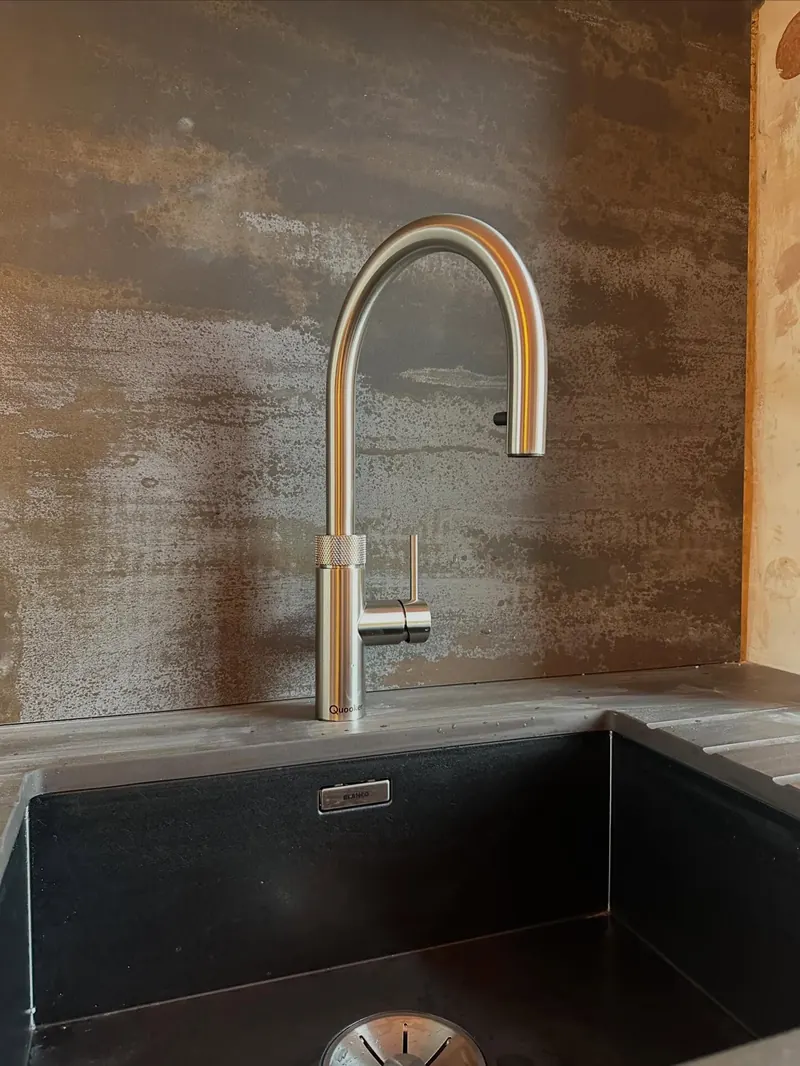 A brushed brass kitchen tap fitted by Addisons