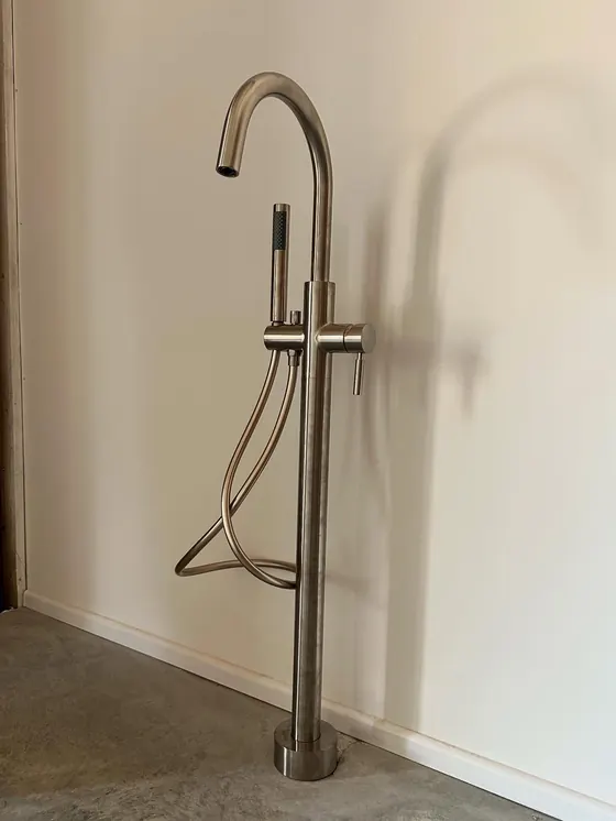 Brushed steel floor-standing bath tap